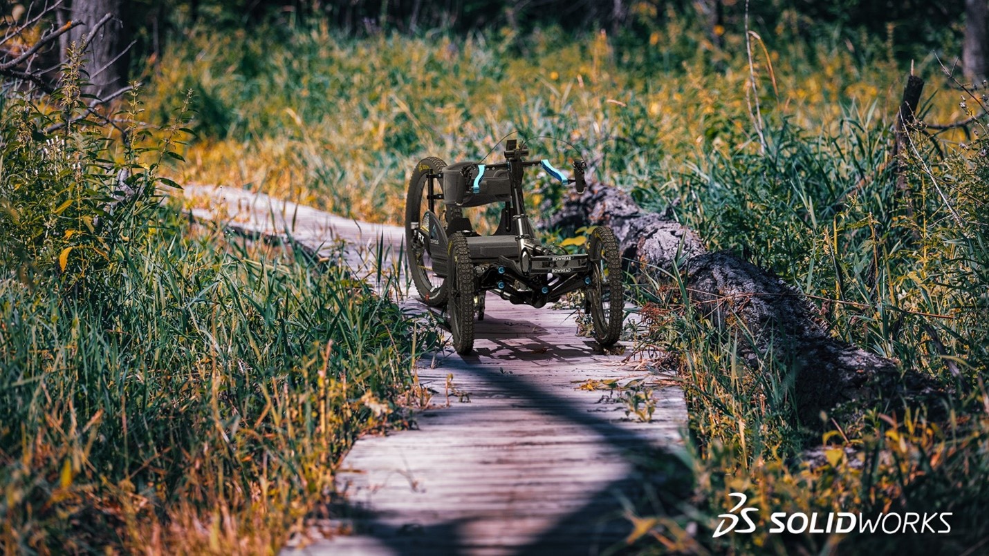 Bowhead bike on a narrow dirt path surrounded by tall grass