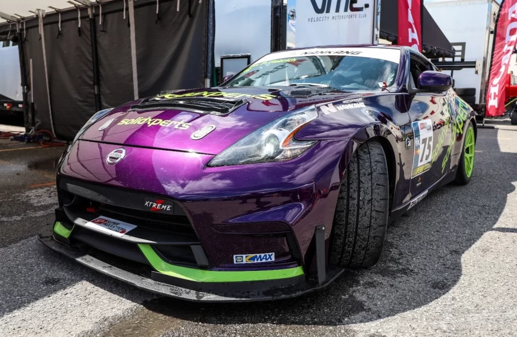 Side view of a Solidxperts branded racing Nissan 370Z at GP3R