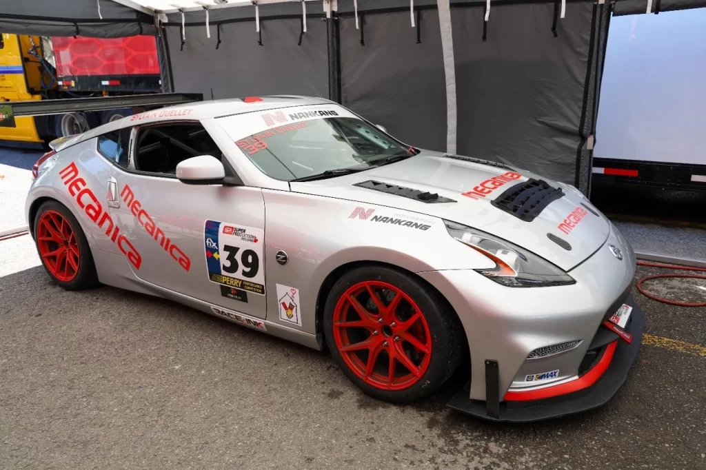 Xtreme Motorsports Mecanica branded Nissan 370Z parked in the paddock