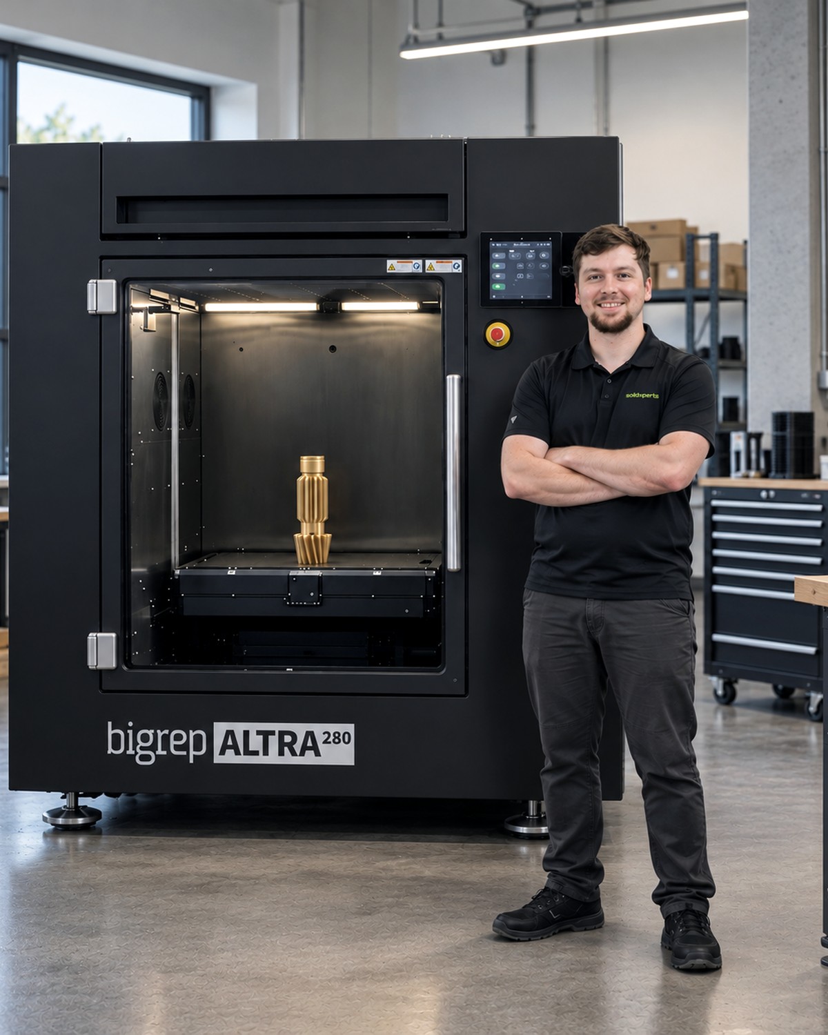 Richard Forcier, Solutions Specialist for Additive Manufacturing and 3D Scanning at SolidXperts, standing beside a BigRep ALTRA 280 with a printed part on the build plate.